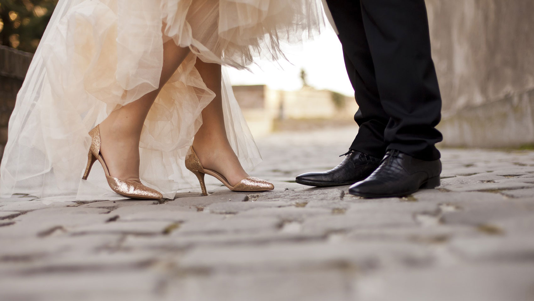closeup of Bride and Groom shoes as they are facing each other