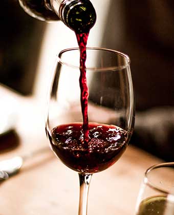 pouring a glass of red wine
